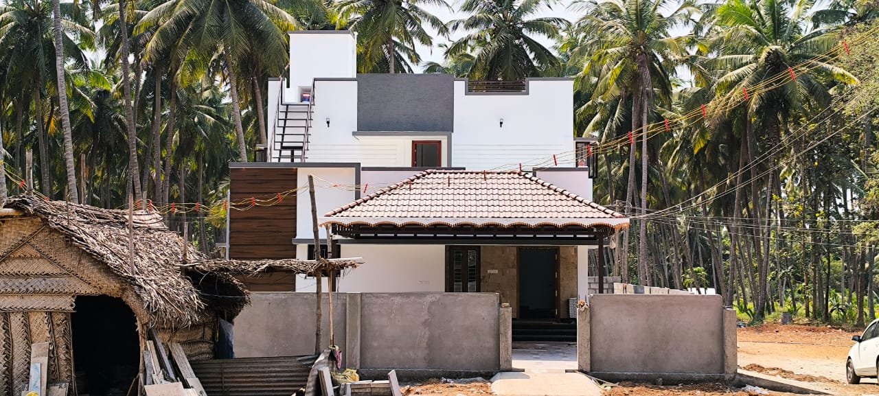 Villa portico view surrounded by coconut trees