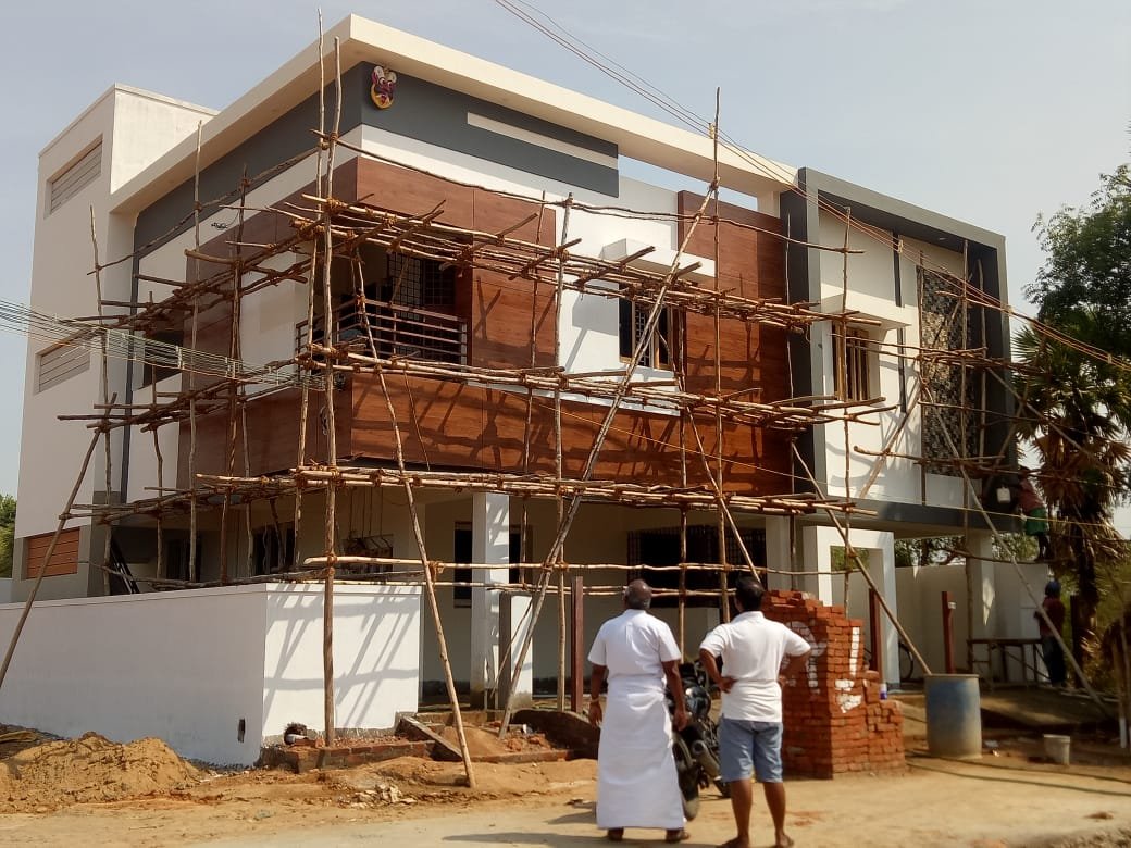 Residential home under construction with scaffolding in Karur